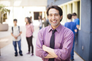 Man smiling in school hallway